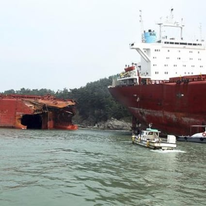 A cargo ship ran aground and snapped in two after Typhoon Bolaven hit Sacheon, South Korea, on Tuesday. Photo: AP