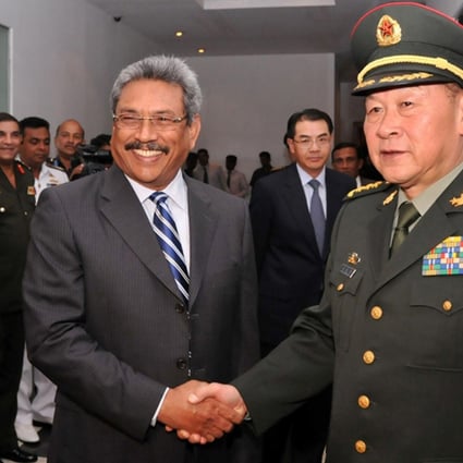 Defence Minister General Liang Guanglie shakes hands with Sri Lankan Defence Secretary Gotabhaya Rajapakse. Photo: AFP