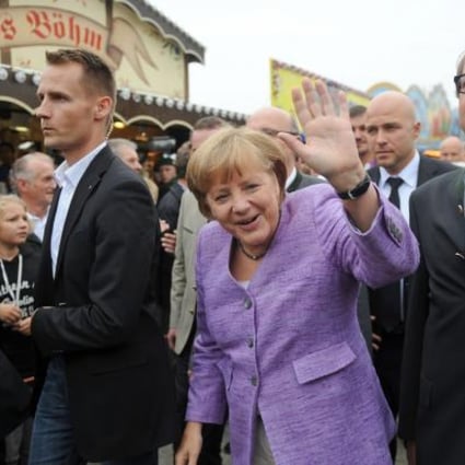 German Chancellor Angela Merkel arrives for the 'political morning pint' event at the Gillamoos fair in Abensberg, southern Germany. Photo: AFP 