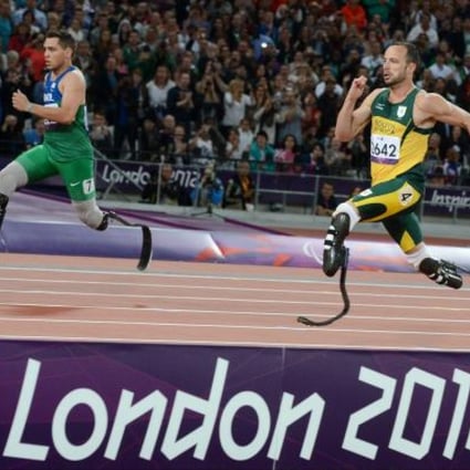 Brazilian Alan Oliveira (left) defeats Oscar Pistorius in the T44 200m on Sunday. Pistorius said he was at a disadvantage because of the length of some of his rivals’ artificial running blades. Photo: EPA