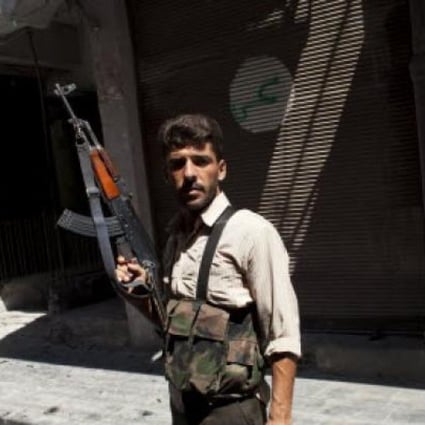  Syrian fighter with the Free Syria Army (FSA) is pictured in the old city of Aleppo on Wednesday. Photo: EPA