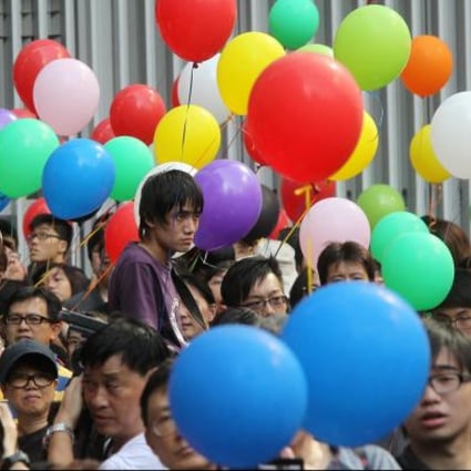 'Occupy Tamar' demonstrators young and old show their colours outside the government headquarters in Admiralty yesterday, maintaining their protest against national education. Photo: K. Y. Cheng