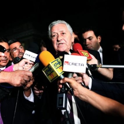 Fotis Kouvelis, leader of the Democratic Left party, addresses the media after a meeting with Greek coalition party leaders in Athens on Sunday. Photo: AP