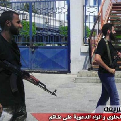 Armed members of Benghazi-based Ansar al-Sharia (Libya),  the group Washington suspects of carrying out the attack on the US Consulate in Benghazi on Monday, are seen in this photo released by the group on Wednesday. Photo: AFP
