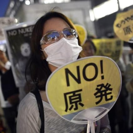 A protester holds a placard during an anti-nuclear power rally in front of the Japanese Prime Minister's official residence in Tokyo, Japan, on September 7. Photo: EPA