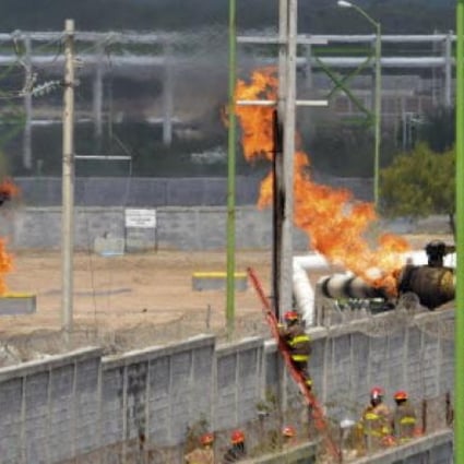 Firefighters try to control a fire after an explosion at a gas pipeline distribution center in Reynosa, near Mexico's border with the US on Tuesday. The fire has killed at least  26 people. 