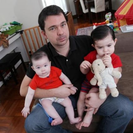 Academic with his two children, aged 18 and 8 months. Photo: SCMP