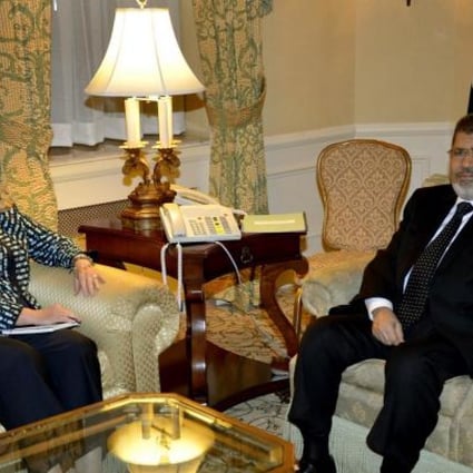 Hillary Rodham Clinton meets Mohammed Mursi. Photo: AFP