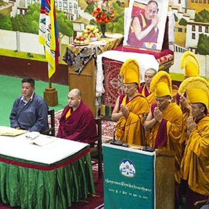 Exiled Tibetan Buddhist monks, in yellow ceremonial hats, pray during the opening ceremony of a special meeting in Dharamshala, India, on Tuesday. Photo: AP