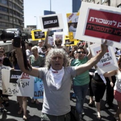 Employees of the Israeli newspaper Maariv demonstrate against their dismissals in Tel Aviv. The iconic Israeli newspaper is on the verge of collapse. Photo: EPA