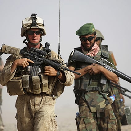 US and Afghan troops in Helmund province. A Nato soldier and a civilian contractor were killed in a suspected insider attack in eastern Afghanistan. Photo: AP