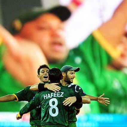 Pakistan captain Mohammad Hafeez celebrates his dismissal of Australia's Cameron White. Photo: AFP 
