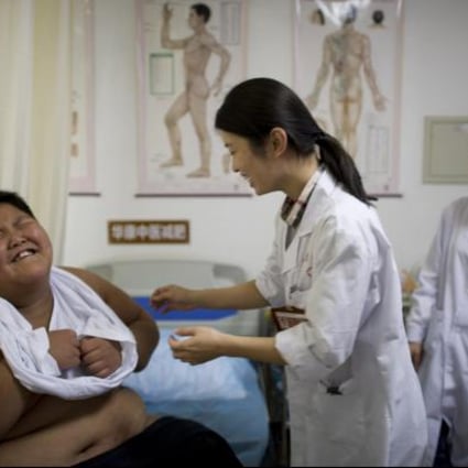 A child undergoes weight-loss therapy in a Beijing hospital. Photo: AFP