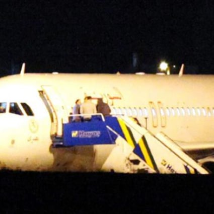 A Syrian passenger plane is seen after it was forced to land at Ankara airport on Wednesday evening on suspicions that it was carrying weapons. Photo: AFP