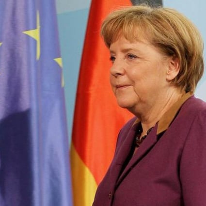 Angela Merkel prepares to deliver her statement on the Peace Prize. Photo: EPA