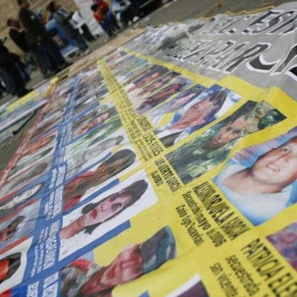 Relatives of victims kidnapped by Farc (pictured above) campaign against an amnesty for the rebels in the peace process. Photo: Reuters
