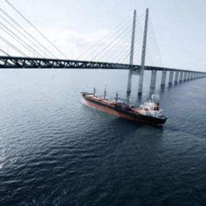 A Lauritzen ship sails under the 7,845-metre Oresund Bridge, the longest road and rail bridge in Europe, which connects Sweden and Denmark.