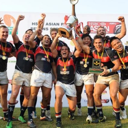 Hong Kong's victorious team celebrate after defeating Japan in the final to win the Mumbai Sevens. The victory makes Hong Kong the top sevens side in Asia. Photo: SCMP