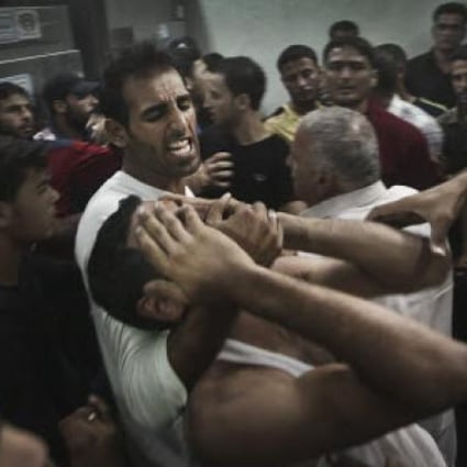A Palestinian man reacts to the death of his relative, one of two Palestinian militants killed in an Israeli air strike, in the Jabaliya Refugee Camp in the northern Gaza Strip. Photo: EPA
