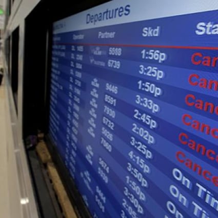 Nearly 15,000 flights were grounded as storm Sandy continued on its path on Monday. Photo: AP
