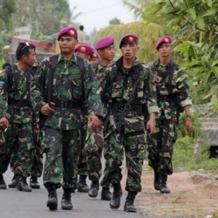 Indonesian soldiers patrol after ethnic clashes in Lampung province. Photo: AP