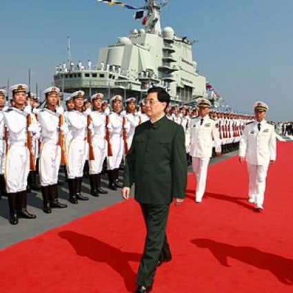 President Hu Jintao inspects the navy on aircraft carrier Liaoning at a naval base in Dalian in September. Photo: AP