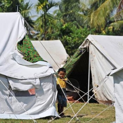 A Ethnic Rakhine child stands beside a tent in Mayebon Internally Displaced Persons (IDP) camp in Rakhine state on November 1. Photo: AFP