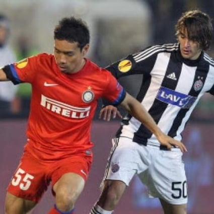 Inter Milan's Yuto Nagatomo (left) fights for the ball with Partizan's Lazar Markovic (right) during their UEFA Europa League group match in Belgrade on Thursday. Photo: EPA