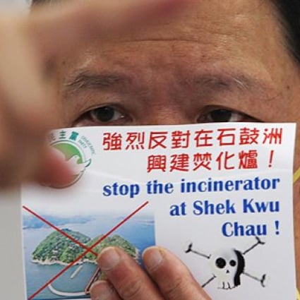 An activist protests against plans for a massive incinerator at Shek Kwu Chau, an island south of Lantau, in April. Photo: David Wong
