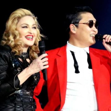 Singer Madonna, left, is shown on stage with South Korean rapper PSY during Madonna's MDNA concert at Madison Square Garden in New York. Photo: AP