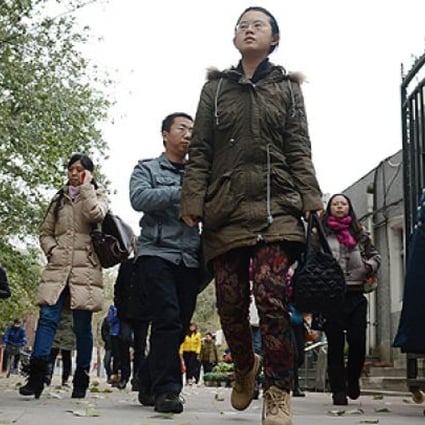 Students leave a middle school to take a lunch break during the annual civil service examinations in Beijing. Photo: AFP