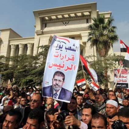 Egypt's top court postponed a hearing that could see the country's Islamist-controlled constituent assembly and upper house of parliament dissolved, after thousands of Islamist protesters surrounded the court building in Cairo.