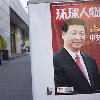 Xi Jinping graces the cover of a news magazine in central Beijing. Photo: EPA