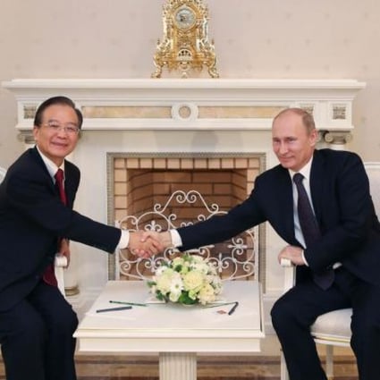 Premier Wen Jiabao meets President Putin. Photo: Xinhua