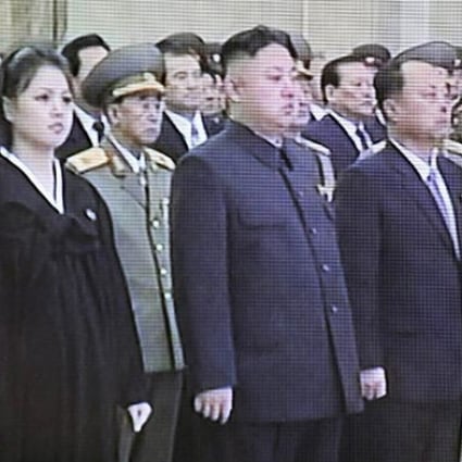 North Korean leader Kim Jong-un and his wife Ri Sol-ju attend a memorial ceremony to mark the first anniversary of the death of Kim Jong-il. Photo: AFP