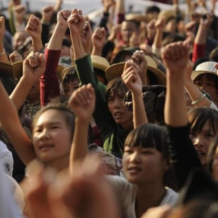 Residents of Wukan rally over illegal land grabs. Photo: AFP
