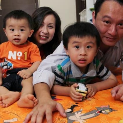 Father Ivan Wong Chin (right) was able to enjoy paternity leave thanks to new company policy. Photo: Edmond So