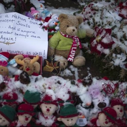 A sign sits at a memorial for those killed in the December 14 shootings at Sandy Hook Elementary School, on Christmas morning in Newtown, Connecticut December 25, 2012. Photo: Reuters