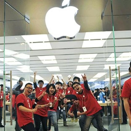 Workers at a new Apple store in Chengdu, in southwest China's Sichuan province. Between one-third to one-half of the iPads sold worldwide are assembled in Chengdu. Photo: AP