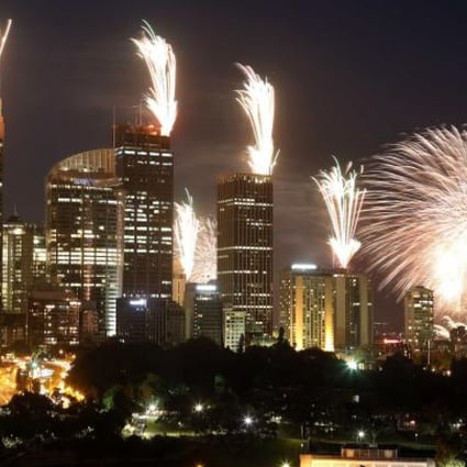 Fireworks explode on the rooftops of buildings in the Sydney during a show prior to the new year celebrations on December 31, 2012. Photo: Reuters