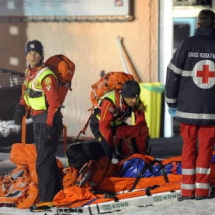  Rescuers of Italian Alpine Relief at Mount Cermis, where six Russian tourists died in an accident with snowmobiles at Cavalese at Trento. Photo: EPA