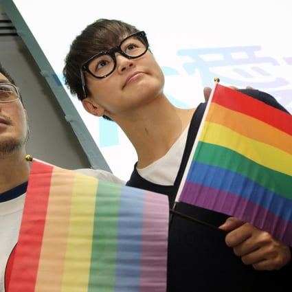 Singers Anthony Wong Yiu-ming and Denise Ho Wan-sze show their support at the launch of the "Big Love" gay rights campaign at the Legislative Council in Tamar, Admiralty, yesterday. The campaign, which will span 18 months, aims to educate the public on a sexual minorities discrimination law, which gay rights groups have called on Chief Executive Leung Chun-ying's administration to introduce. Photo: K. Y. Cheng