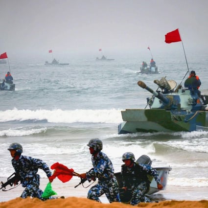 Sino-Russian amphibious tanks and marines storm a beachhead in a 2005 assault drill. Photo: AFP
