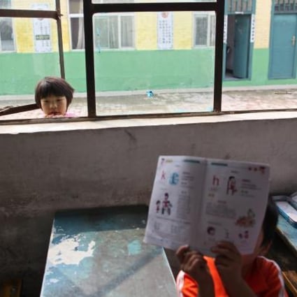 School for migrant children starts school term early as forced closure looms. Migrant workers in cities are generally poorly educated mainly due to a hereditary household registration. Photo: EPA