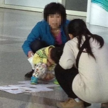 A toddler is seen relieving himself in public. SCMP photo.