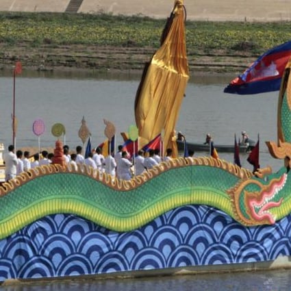 A royal barge carries the ashes on the Mekong. Photo: AP