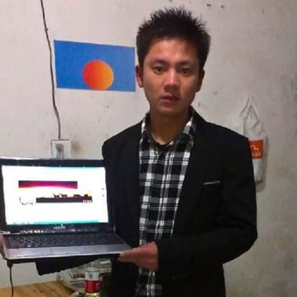 Zhang Hungming poses with his personal computer, which he runs the popular fan page for the Communist Party's General Secretary Xi Jinping. Photo: AP