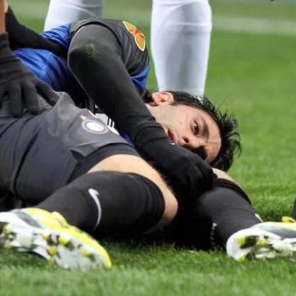Inter's Diego Milito is hurt in a Europa League match. Photo: EPA