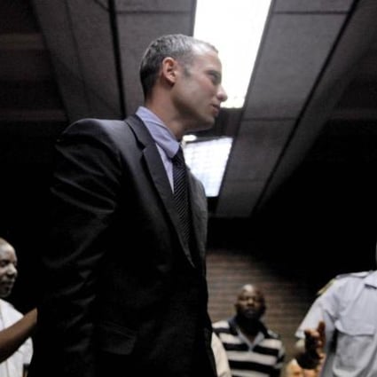 Oscar Pistorius was charged on Friday with the murder of 29-year-old Reeva Steenkamp. Photo: AFP