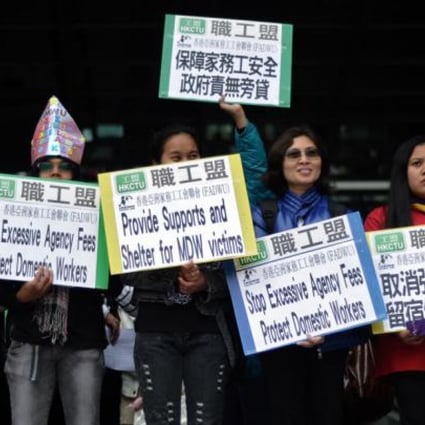Domestic helpers gather to ask the government in Hong Kong to protect them from violence. Photo: AFP